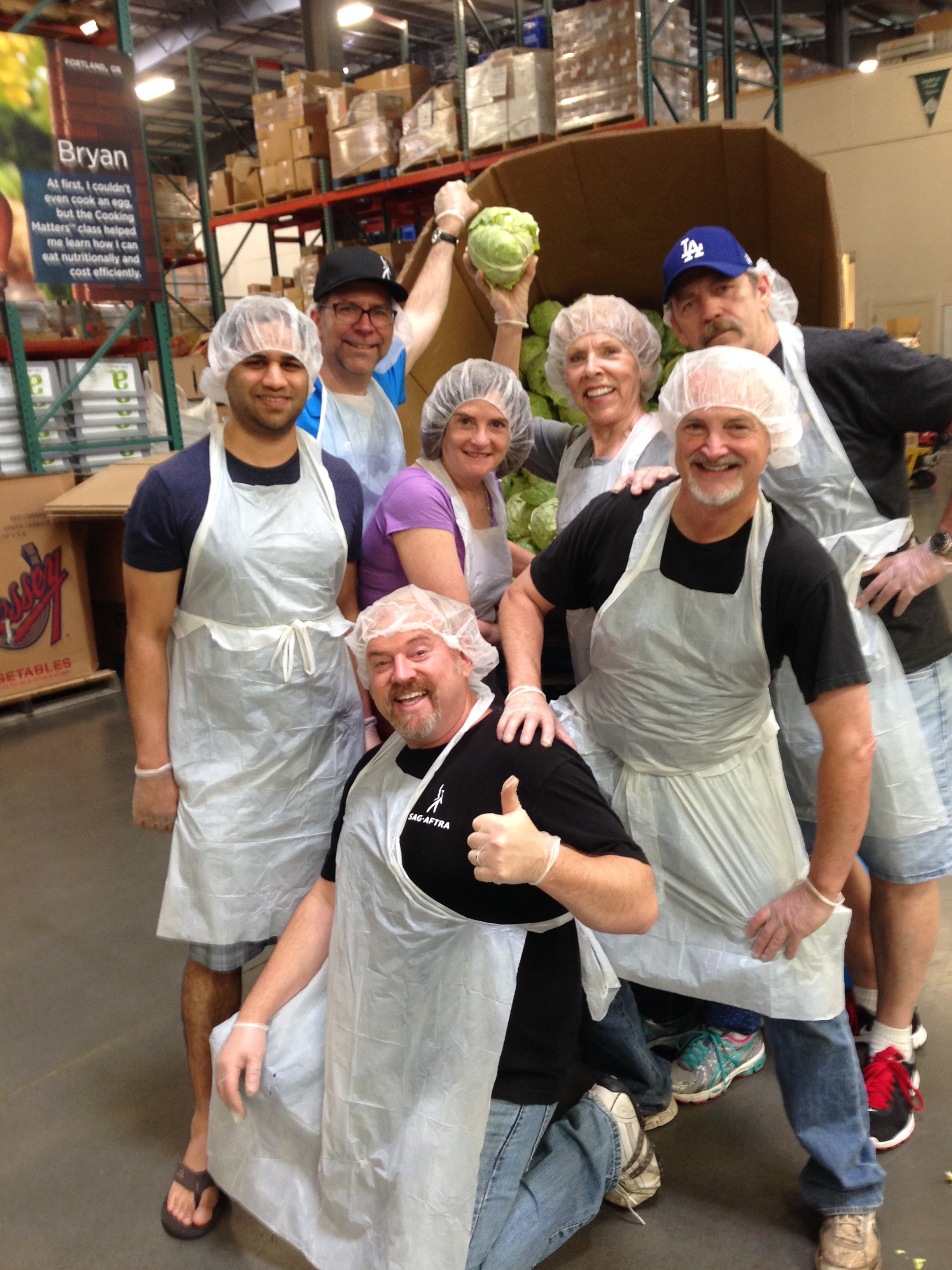 SAG-AFTRA Portland Local members (L-R) Neil Shah, Harold Phillips, Duane Hanson, Cyndi Rhoades, Pat Lach, Steve Pitzel & Ron Barnes tossed several tons of cabbage, potatoes and apples for their state's hungriest and food insecure residents at Oregon Food Bank.  