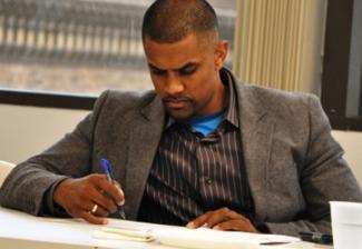 Jeremy Panicker reviews his notes.