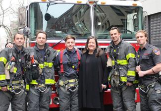 New York President Rebecca Damon with first responders from FDNY Ladder Company 3.