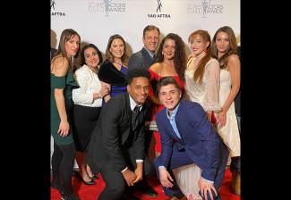 New England Local members have fun on the red carpet. Back row, from left: Ashley Cerrone, Alin Halajian, Michelle Romano, Robert Marsella, Anastasia Mousis, Kayla Caulfield and Kate Becker; front row, from left: Juvan Elisma and Domenic Arduino.