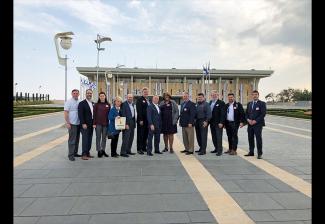 National Board member Ellen Crawford, fourth from left, with the delegation in front of the Knesset, Israel’s parliament.