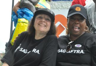 Left, Barbara Ann Martin and Arlette Carr, Chicago Local Singers Committee members, lend their voices for solidarity at last year’s Labor Day Parade.