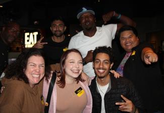 Members smile and pose for the camera at Dave & Buster's