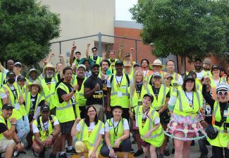 L.A. strike volunteers arrive at Netflix early to go over route and safety logistics for the L.A. solidarity march and rally. 