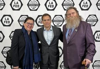 De La Cruz, Pierson and Scullin stand in front of a backdrop with L.A. County Federation of Labor logos.