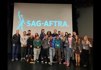 Miami business representative Jenna Dosch with future filmmakers at Miami Dade College on Feb. 3. 