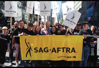 New York Local President Rebecca Damon and U.S. Sen. Chuck Schumer marched with members at the 2019 New York City Central Labor Council Labor Day Parade.