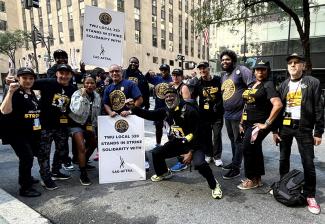 Strike captains at the NBCUniversal picket site pose with members of Transport Workers Unions.