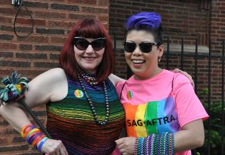 Members Suzy Brack and Belle Lopez show their Pride colors.
