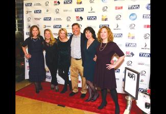 Guests on the red carpet at the joint holiday party on Jan. 25. (Photo by Ross Stansfield)