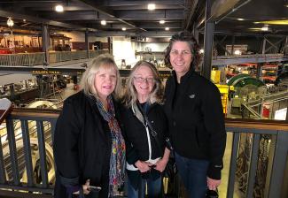 From left, Nordstrand, Howell and West inside of a museum exhibition room.