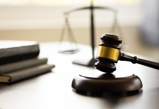 Gavel, stack of books and a scale