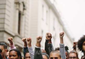 Crowd with solidarity fists raised