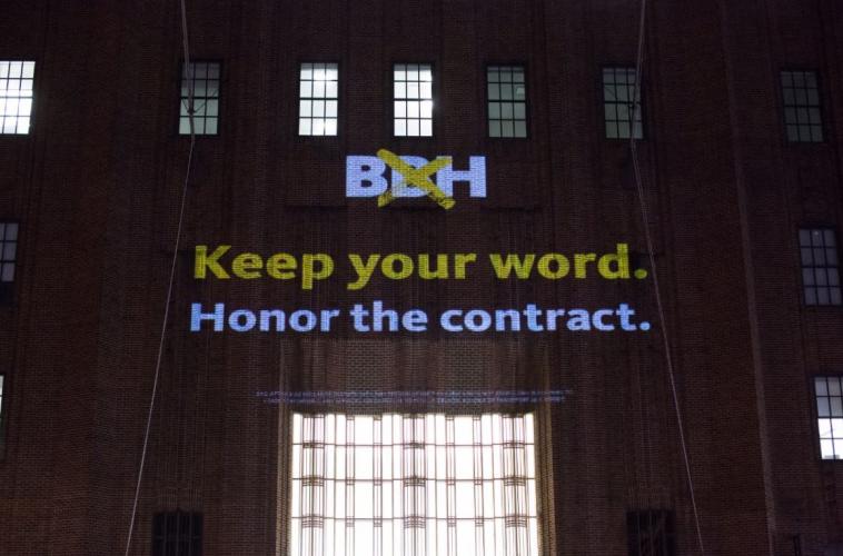 Projection on a building "BBH, Keep your word. Honor the contract."