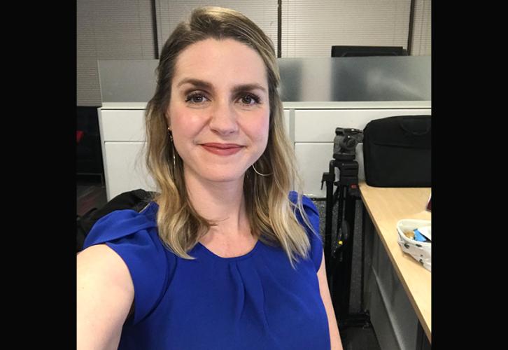 Kate Rooney at her desk. 