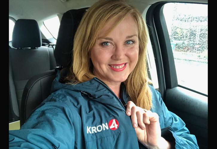 Maureen Kelly shows off her blue KRON-TV hoodie in a selfie. 