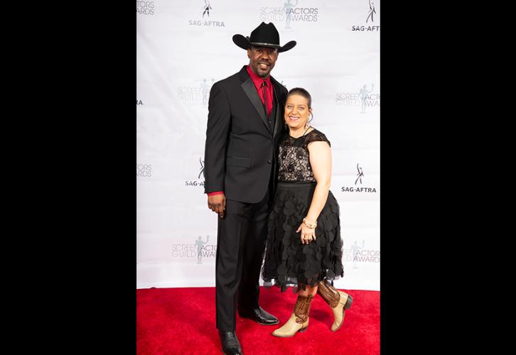 Local Board member Avery White, left, and his wife Elizabeth know how to kept things “Texas chic” on the red carpet. Photo by SuperCybers