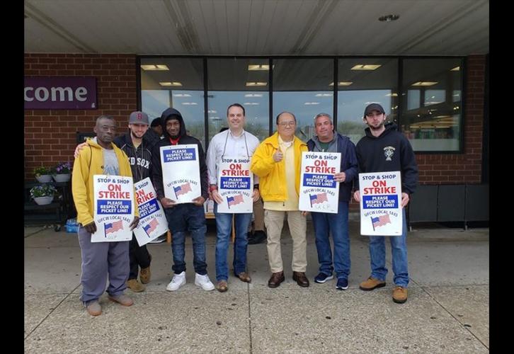 Days after the April 18 rally, local board member Chuck Slavin and member Freddie Wong, center, stand with United Food and Commercial Workers International Union on April 21. (Photo by Chuck Slavin)