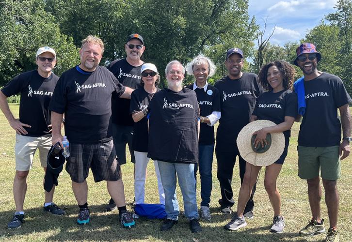 Local President Charles Gardner, right, and SAG-AFTRA members gather at Eddie Fest in Eggers Grove Forest Preserve following the Labor Day parade.