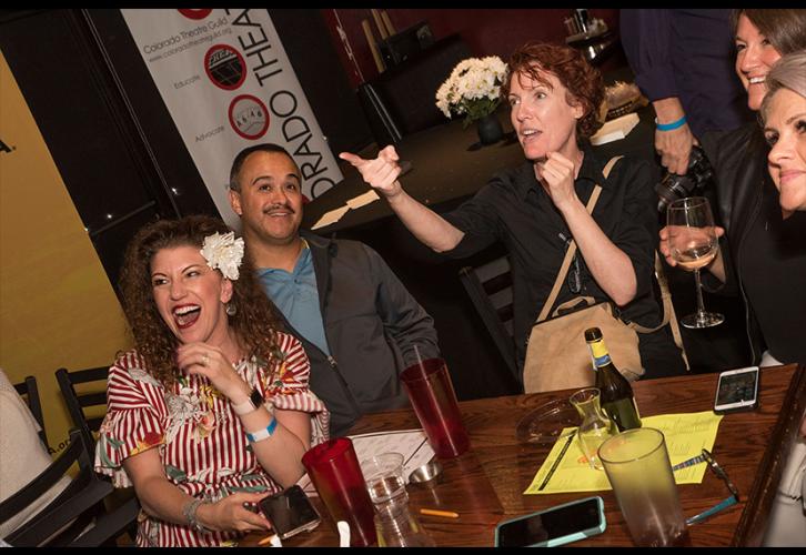 Michelle Sergiff, far left, her husband and friends look at the awards ceremony taking place off-screen.