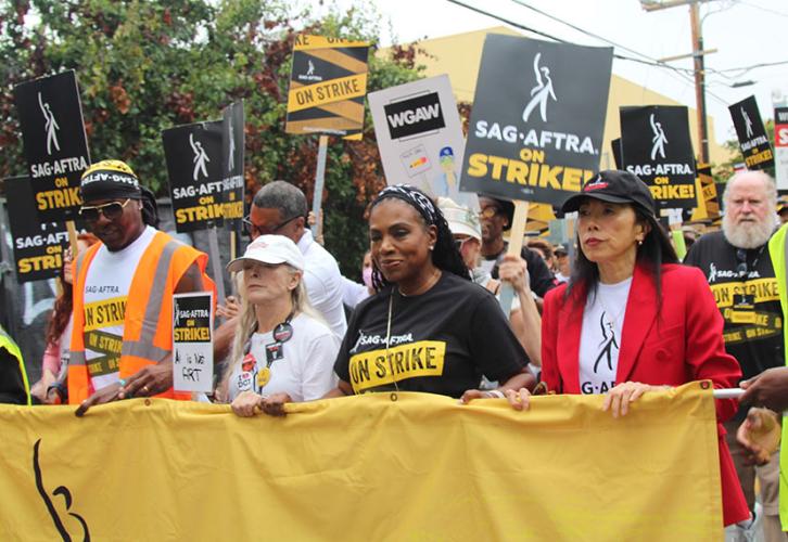 From left, SAG-AFTRA organizer Derron Ware, L.A. Local Board member Frances Fisher, L.A. Local First Vice President Sheryl Lee Ralph, L.A. Local President Jodi Long and L.A. Local Second Vice President David Jolliffe lead the crowds from Netflix to Paramo