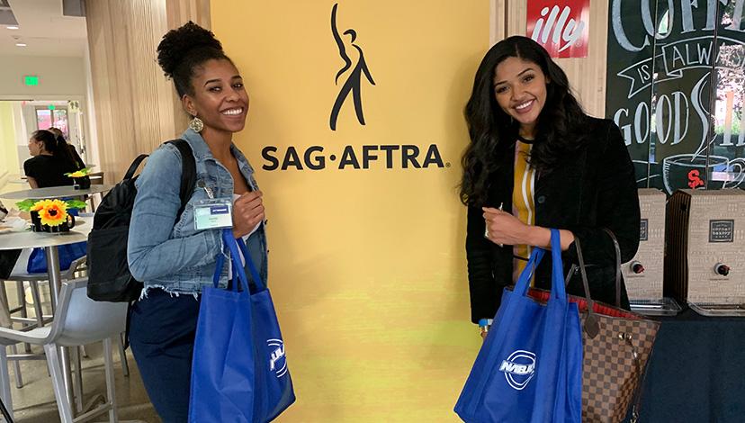 Students show off their NABJLA swag in front of the SAG-AFTRA banner. 