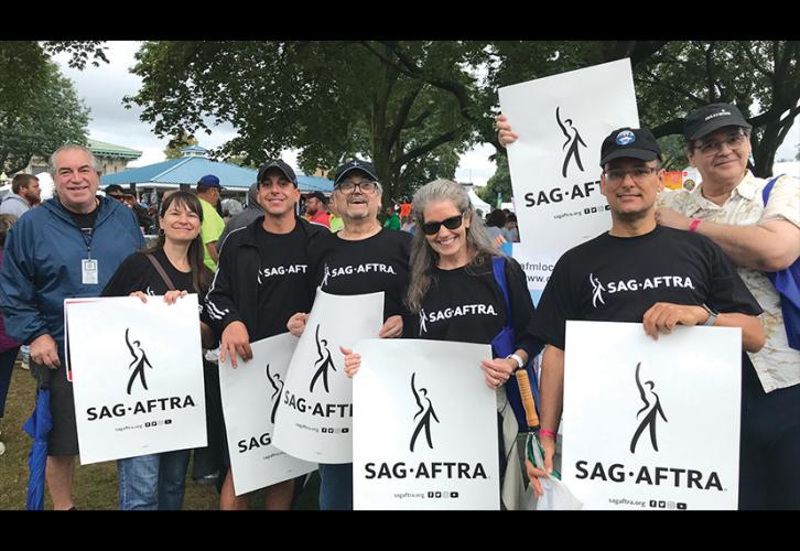 Member parade coordinator volunteers Ray Pagano, center, and Patrick Klein, third from left, with the SAG-AFTRA contingent at the New York State Fair and Labor Day parade in Syracuse.