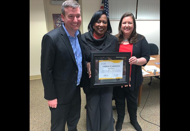 From left, Michigan Local Board President Eric Wydra, broadcaster Vickie Thomas and Executive Vice President Rebecca Damon