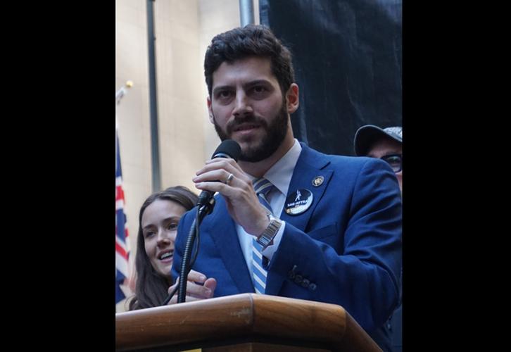 NY State Assemblymember Alex Bores addresses the crowd.