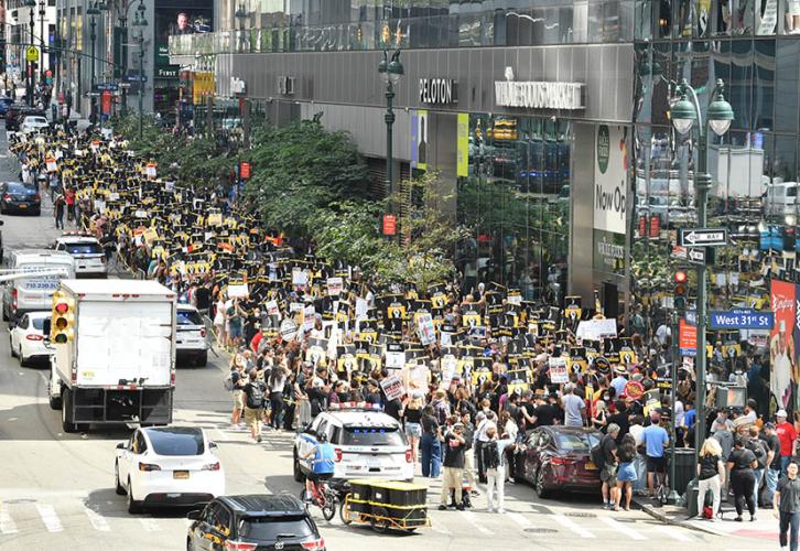 The picket line stretches along 10th Avenue.
