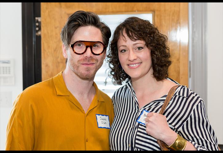Two individuals--one male, one female--takes a photo in the Nashville Local office.
