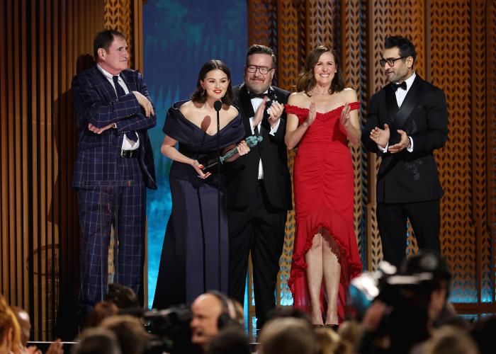 From left, Richard Kind, Selena Gomez, Michael Cyril Creighton, Molly Shannon and Kumail Nanjiani are on stage. Gomez holds the SAG Awards statuette.