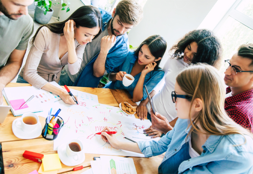The Executive Actor: 7 Seats at the Boardroom Table A diverse group of people work around a table.