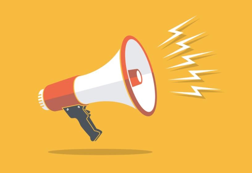 bullhorn on yellow background