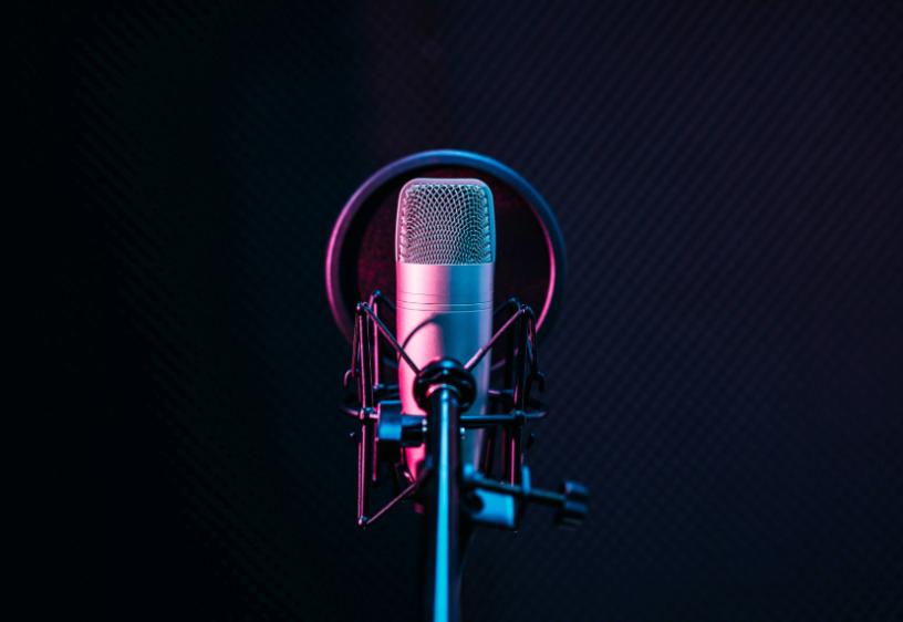 SAG-AFTRA Singers and Recording Artists A studio microphone is centered in the frame on a black background