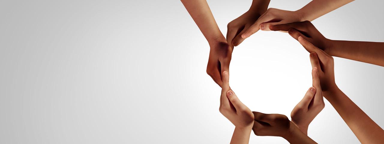 Image of hands forming a circle.