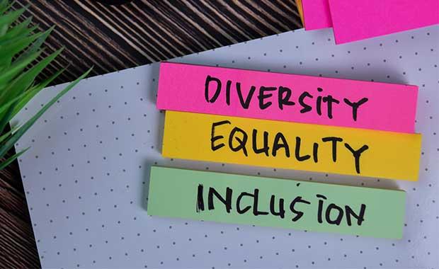 Image of three colorful post-it notes with 'Diversity' 'Equality' and 'Inclusion' handwritten on each.
