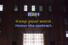 Projection on a building "BBH, Keep your word. Honor the contract."