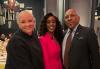 From left, Davis, Hunter and Knight stand closely for a group photo. Davis wears a black dress with gold bracelets, Hunter wears a pink pants suit and Knight wears a dark brown suit with a SAG-AFTRA pin. The room is elegantly decorated with low lighting.