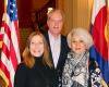 Nancy Flanagan, Donald Zuckerman & Sheila Ivy Traister photo of 3 board members at the State Capitol in front of the stairwell and American flag