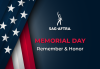 Against a dark-blue backdrop is the SAG-AFTRA logo and the words "Memorial Day Remember & Honor." "Memorial Day" is in red; "Remember & Honor" is in white. To the left a folded American flag.
