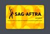 Graphic image of the May 2022 SAG-AFTRA membership card against a gray backdrop. The card is bright yellow and inscribed with "2022" in bright orange with the SAG-AFTRA logo in black. Hero image for "Your Membership Card Is On Its Way!"