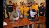 Oregon AFL-CIO President Tom Chamberlain, left, and Portland Diamond Project President Craig Cheek sign labor harmony agreement July 29, as SAG-AFTRA Portland Local members and other representatives from Oregon labor organizations look on. Oregon AFL-CIO President Tom Chamberlain, left, and Portland Diamond Project President Craig Cheek sign labor harmony agreement July 29, as SAG-AFTRA Portland Local members and other representatives from Oregon labor organizations look on.