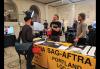 SAG-AFTRA Portland members Todd A. Robinson and Jeff Rosick stand behind a table bearing the SAG-AFTRA logo and information. SAG-AFTRA Portland members Todd A. Robinson and Jeff Rosick stand behind a table bearing the SAG-AFTRA logo and information.