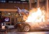 Male stunt performer is teethered above a car on fire on the set of CW's "The Flash." Male stunt performer is teethered above a car on fire on the set of CW's "The Flash."